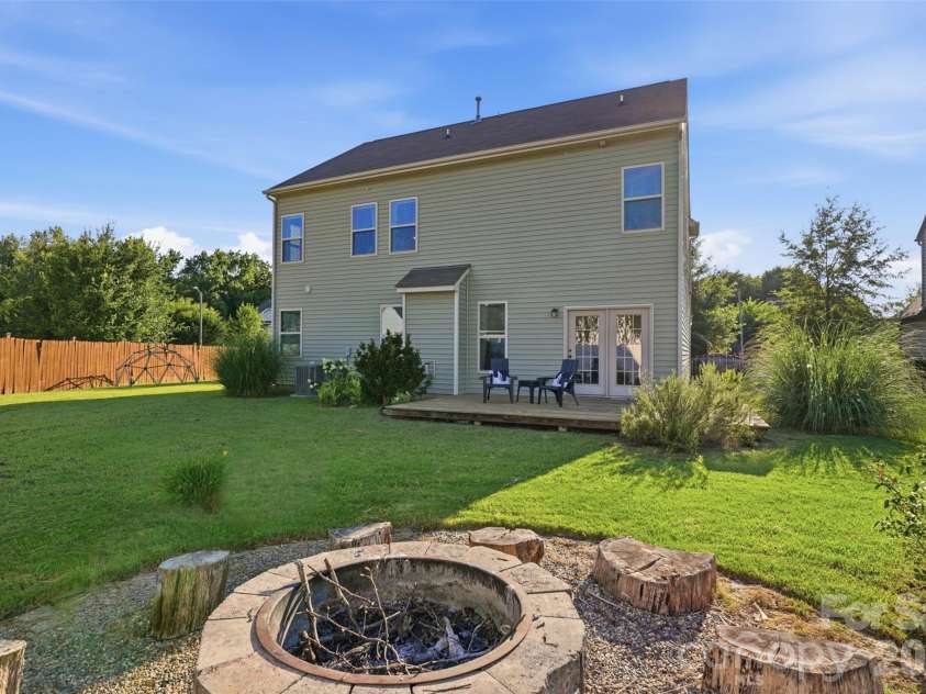 10022 Wrigley Drive, Charlotte, NC 28273.  MLS# CAR4400903, YatesRealty ID 37064. Fire pit area in back yard