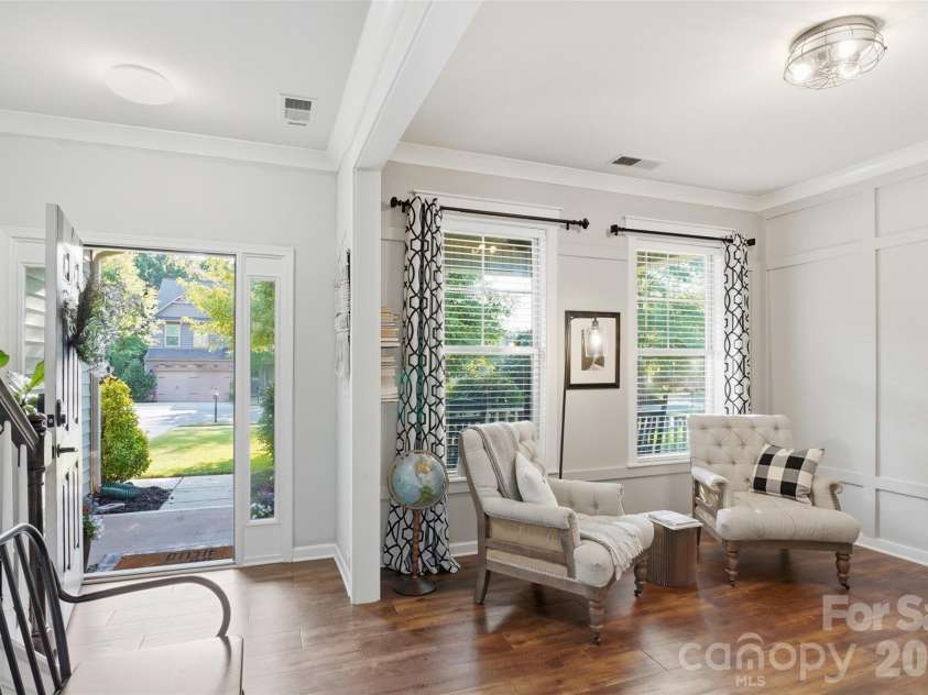 10022 Wrigley Drive, Charlotte, NC 28273.  MLS# CAR4400903, YatesRealty ID 37064. Front room with custom paneling