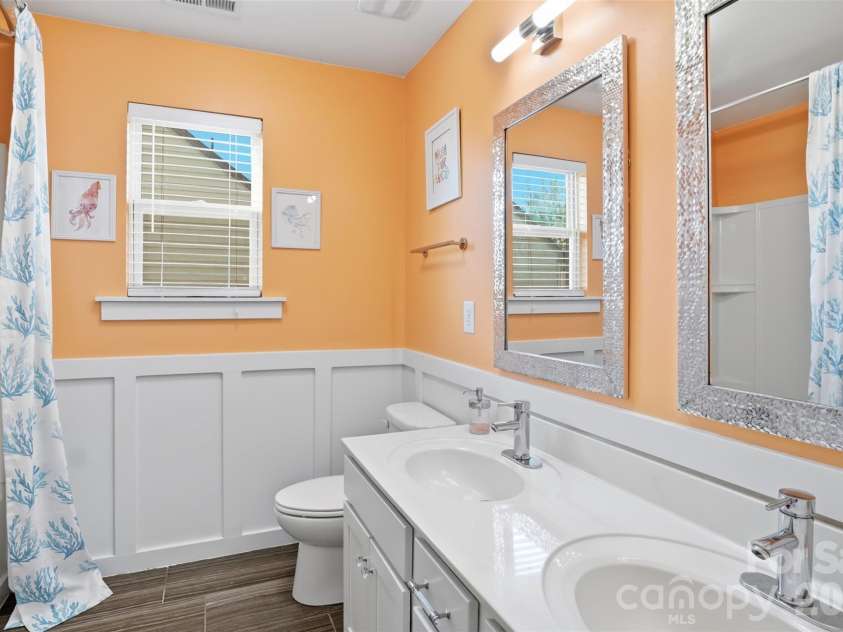 10022 Wrigley Drive, Charlotte, NC 28273.  MLS# CAR4400903, YatesRealty ID 37064. Hallway bathroom with double sinks