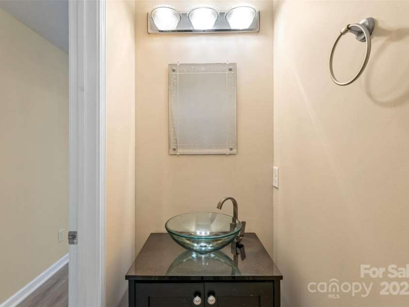 3005 Woodbluff Drive, Greensboro, NC 27406.  MLS# CAR4224024, YatesRealty ID 3707. Half bath on main level in hallway
