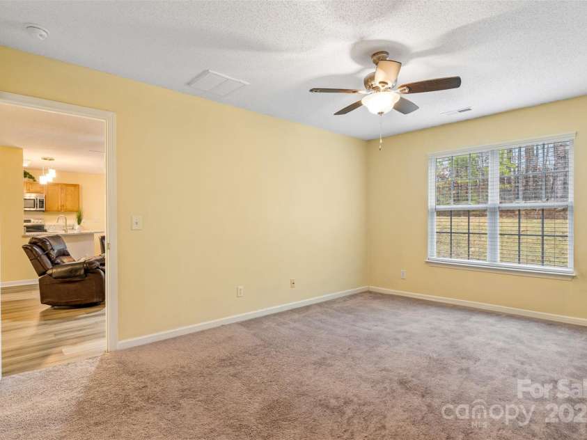3005 Woodbluff Drive, Greensboro, NC 27406.  MLS# CAR4224024, YatesRealty ID 3707. Main level primary bedroom