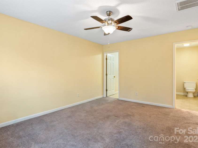 3005 Woodbluff Drive, Greensboro, NC 27406.  MLS# CAR4224024, YatesRealty ID 3707. Main level primary bedroom