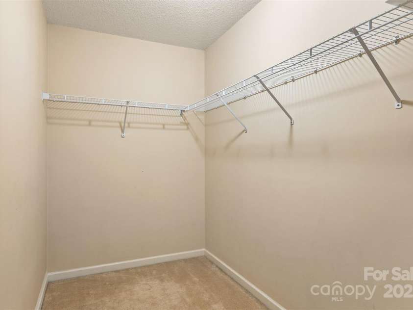 3005 Woodbluff Drive, Greensboro, NC 27406.  MLS# CAR4224024, YatesRealty ID 3707. Main level primary bedroom closet
