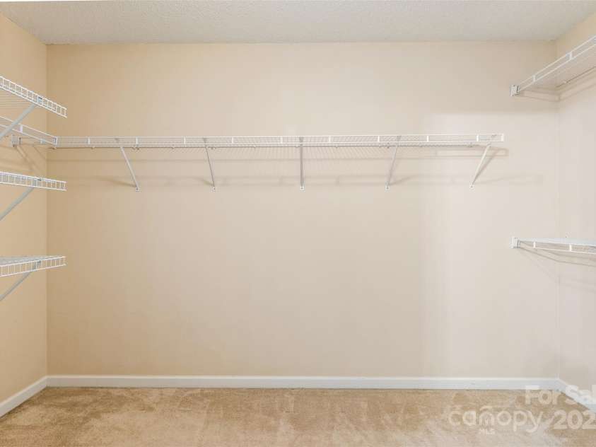 3005 Woodbluff Drive, Greensboro, NC 27406.  MLS# CAR4224024, YatesRealty ID 3707. Second level primary bedroom closet