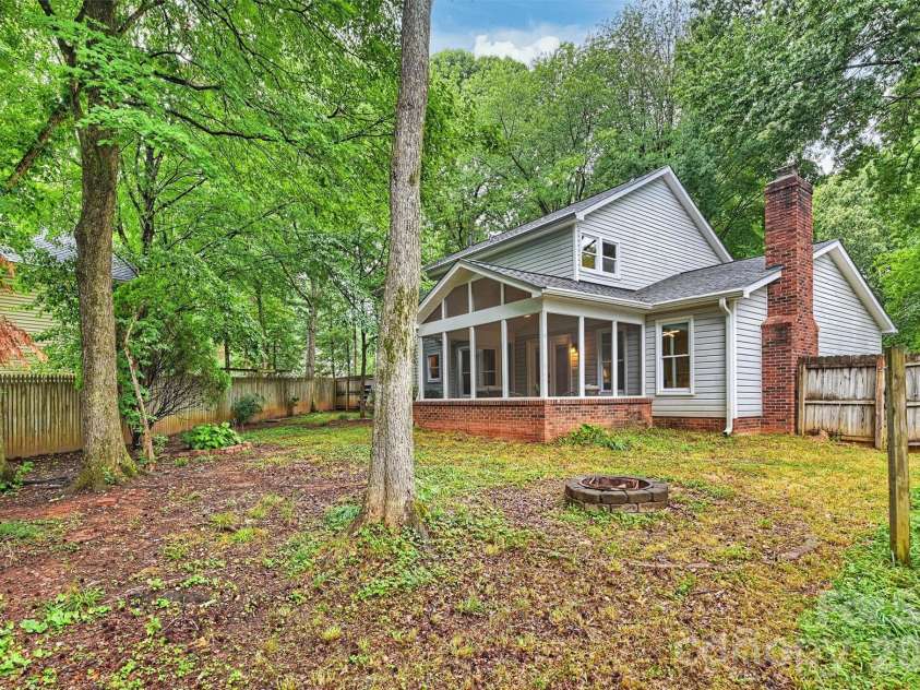 2500 Crescent Knoll Drive, Matthews, NC 28105.  MLS# CAR4399861, YatesRealty ID 37086. Back exterior view of home