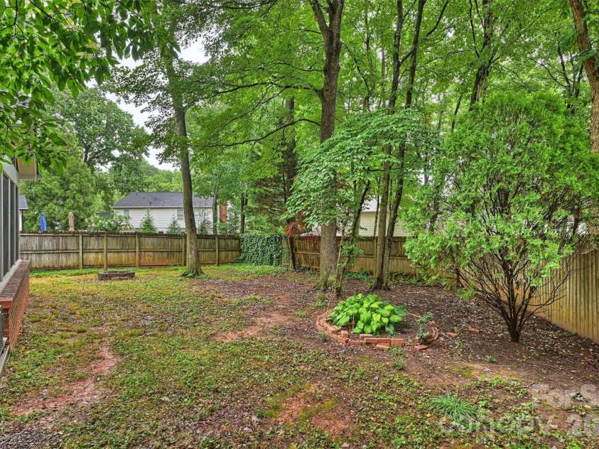 2500 Crescent Knoll Drive, Matthews, NC 28105.  MLS# CAR4399861, YatesRealty ID 37086. Fully-fenced backyard