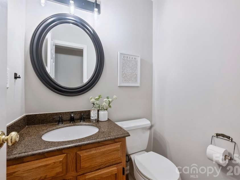 2500 Crescent Knoll Drive, Matthews, NC 28105.  MLS# CAR4399861, YatesRealty ID 37086. Half bath on main level.