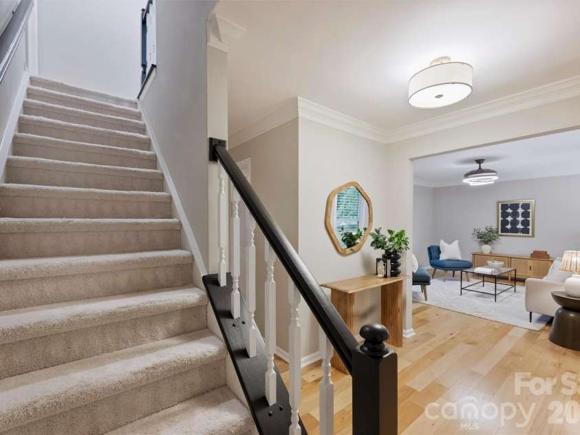 2500 Crescent Knoll Drive, Matthews, NC 28105.  MLS# CAR4399861, YatesRealty ID 37086. Stairs leading to upper level.