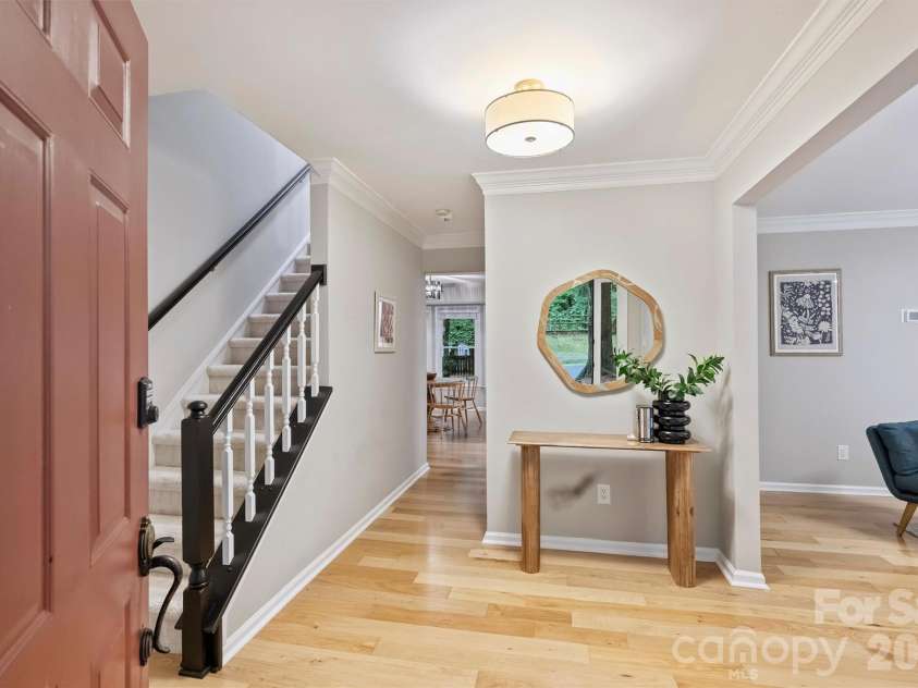 2500 Crescent Knoll Drive, Matthews, NC 28105.  MLS# CAR4399861, YatesRealty ID 37086. Step inside to find fresh interior paint, updated lighting, and new hardwood flooring throughout the main level.