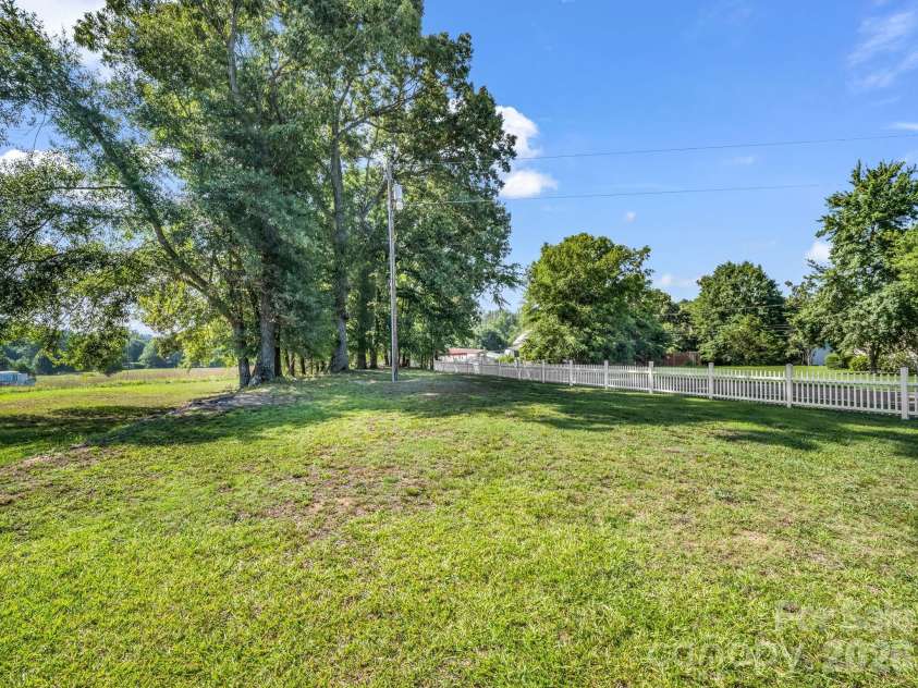 599 Old Henrietta Road, Forest City, NC 28043.  MLS# CAR4400651, YatesRealty ID 37087. Side yard