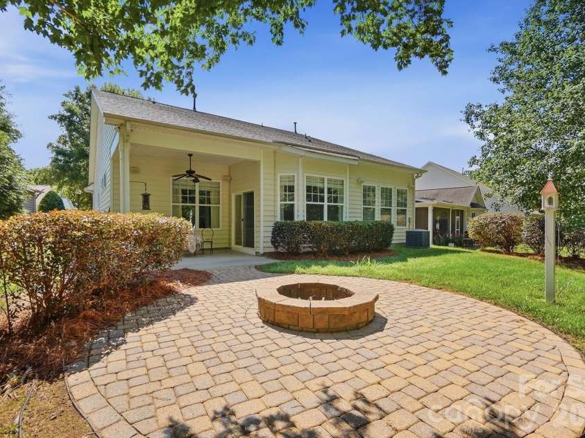 3076 Streamhaven Drive, Fort Mill, SC 29707.  MLS# CAR4403200, YatesRealty ID 37089. Paver patio w/ fire pit
