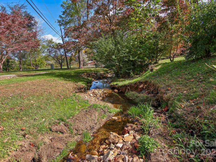 396 & 400 Will Hyatt Road, Waynesville, NC 28786.  MLS# CAR4191538, YatesRealty ID 3709. One or two creeks on property