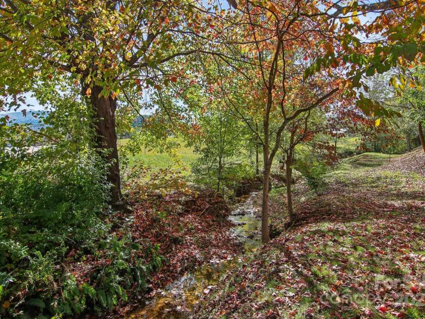 396 & 400 Will Hyatt Road, Waynesville, NC 28786.  MLS# CAR4191538, YatesRealty ID 3709. One or two creeks on property