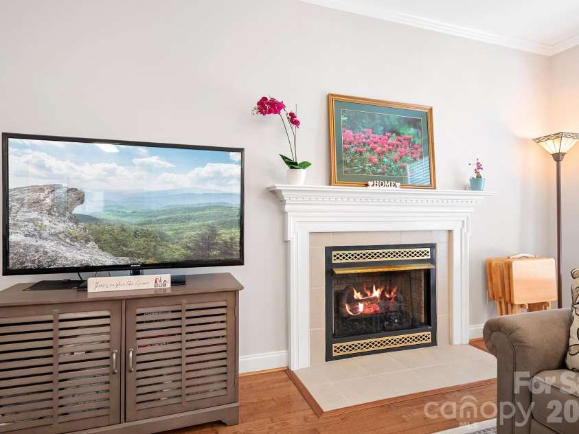 215 Knops Nob Road, Mooresville, NC 28115.  MLS# CAR4402529, YatesRealty ID 37098. Gas log fireplace in living room
