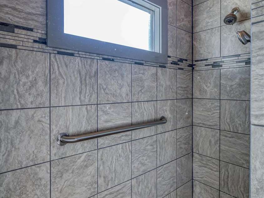 2262 Grandview Peaks Drive, Nebo, NC 28761.  MLS# CAR4355618, YatesRealty ID 3710. L-shaped tile shower