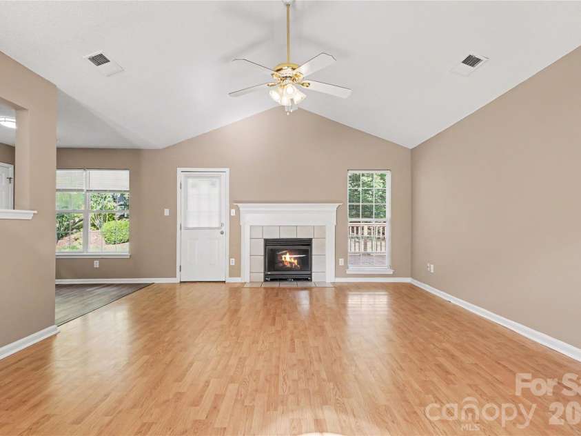 3786 Sedgewick Street, Concord, NC 28027.  MLS# CAR4397851, YatesRealty ID 37104. Living room  vaulted ceiling fireplace