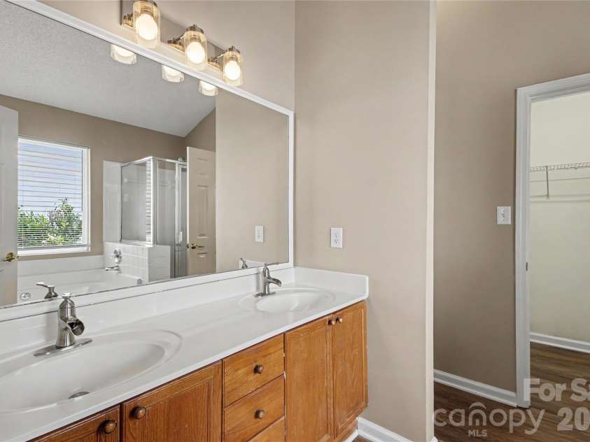 3786 Sedgewick Street, Concord, NC 28027.  MLS# CAR4397851, YatesRealty ID 37104. Primary bath with dual vanity and redesigned mirrors walk-in closet and seperate shower/garden tub