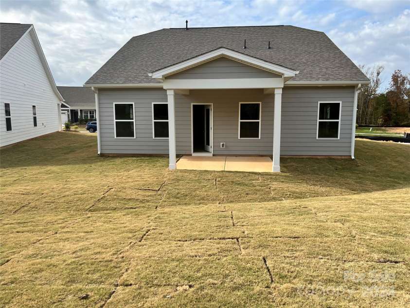 1044 Bull Dog Lane, Wingate, NC 28174.  MLS# CAR4192552, YatesRealty ID 3713. Enjoy sitting on your covered patio!