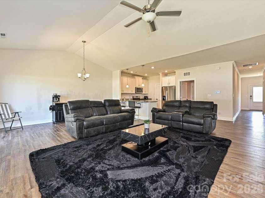 2119 Osten Run, Monroe, NC 28110.  MLS# CAR4403557, YatesRealty ID 37139. Great room with vaulted ceiling and ceiling fan.