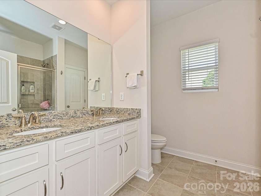 2119 Osten Run, Monroe, NC 28110.  MLS# CAR4403557, YatesRealty ID 37139. Primary bath features two sinks and granite counters