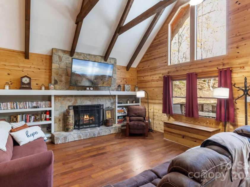 563 Bee Tree Lane, Mars Hill, NC 28754.  MLS# CAR4317356, YatesRealty ID 3714. Gas fireplace with new remote controled insert installed