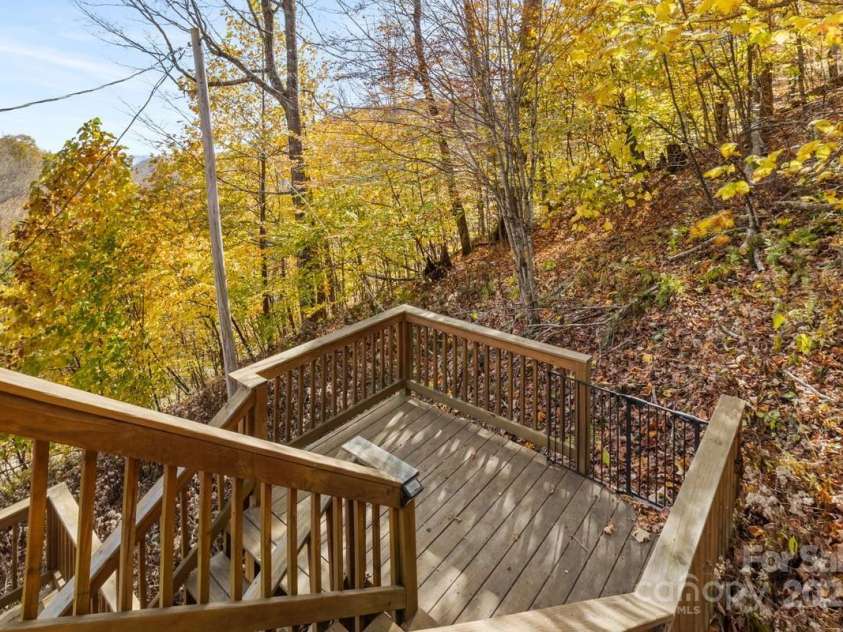 563 Bee Tree Lane, Mars Hill, NC 28754.  MLS# CAR4317356, YatesRealty ID 3714. Steps from upstairs balcony to downstairs screened in porch
