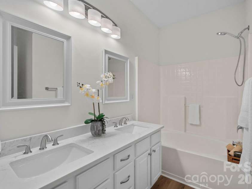 771 Old Meeting Way, Davidson, NC 28036.  MLS# CAR4403687, YatesRealty ID 37153. Private ensuite bath with dual vanity