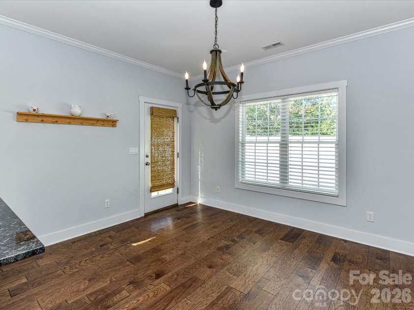 423 Ellicott Lane, Locust, NC 28097.  MLS# CAR4401969, YatesRealty ID 37156. AI Generated