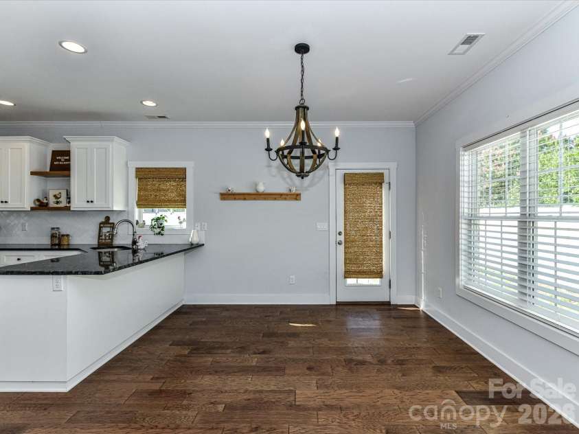 423 Ellicott Lane, Locust, NC 28097.  MLS# CAR4401969, YatesRealty ID 37156. AI Generated