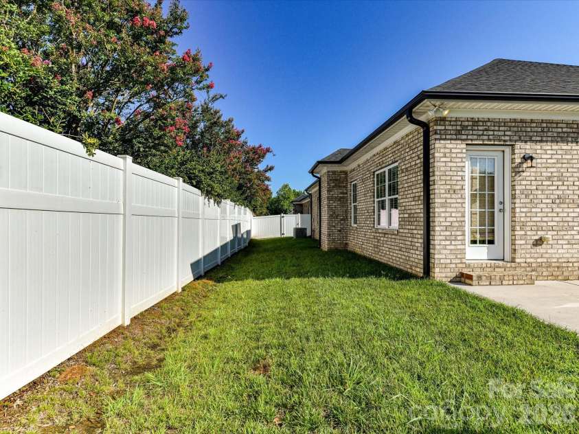 423 Ellicott Lane, Locust, NC 28097.  MLS# CAR4401969, YatesRealty ID 37156. AI Generated