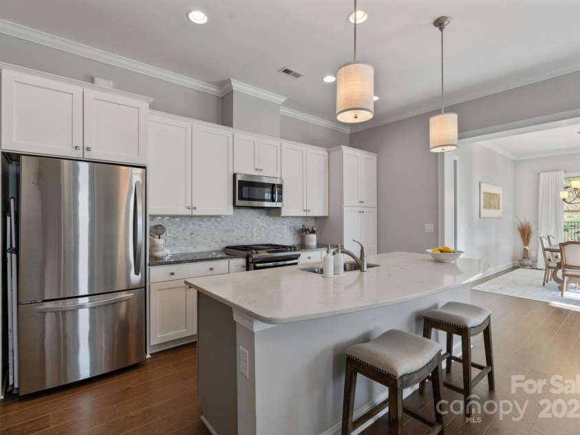 7127 Hanging Rock Court, Denver, NC 28037.  MLS# CAR4232308, YatesRealty ID 3716. Kitchen w/ White Cabinets and SS Appliances