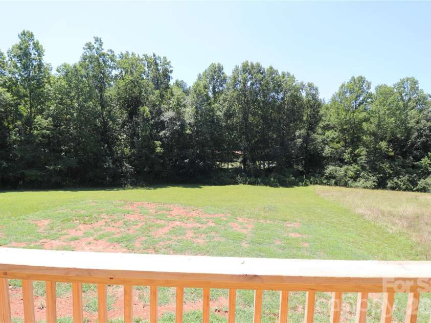 3093 Peaceful Meadows Drive, Morganton, NC 28655.  MLS# CAR4404361, YatesRealty ID 37162. Back yard