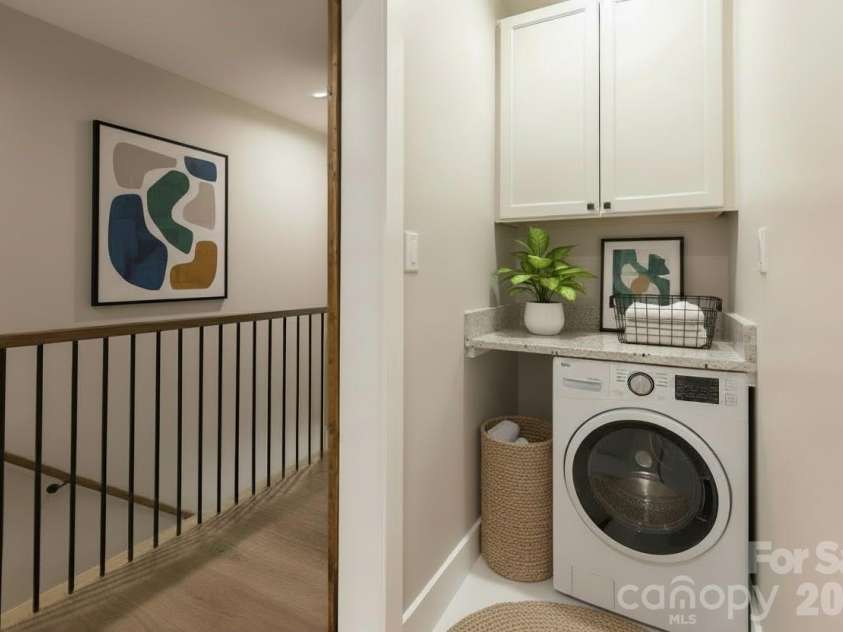 328 Bowditch Street, Burnsville, NC 28714.  MLS# CAR4332968, YatesRealty ID 3720. Convenient laundry area located between both primary suites.