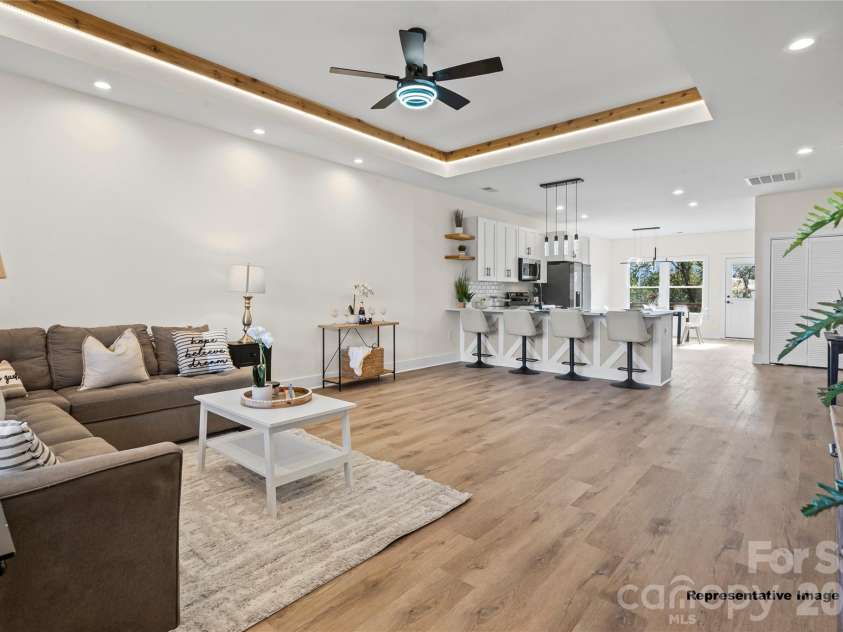 712 Jackson Terrace, Concord, NC 28027.  MLS# CAR4404681, YatesRealty ID 37214. Living Room/Kitchen(Representative Image)