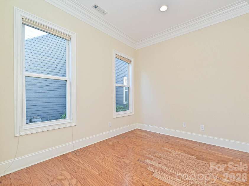 21816 Chapel Way, Cornelius, NC 28031.  MLS# CAR4400108, YatesRealty ID 37244. Office on the main level with crown molding and large windows