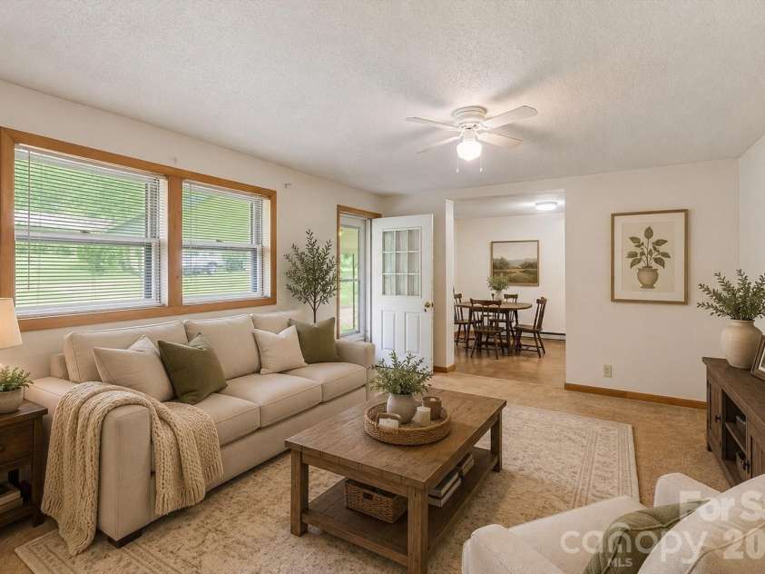 43 Open Valley Road, Marion, NC 28752.  MLS# CAR4404058, YatesRealty ID 37256. Virtually staged living room