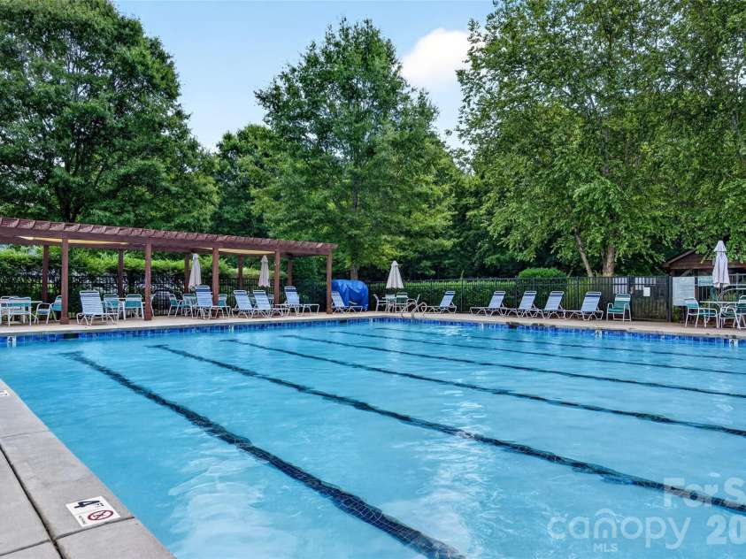 6405 Alba Rose Lane, Huntersville, NC 28078.  MLS# CAR4397325, YatesRealty ID 37262. 25 yard lap pool with pergola. Home of the Stingrays Summer League Swim Team