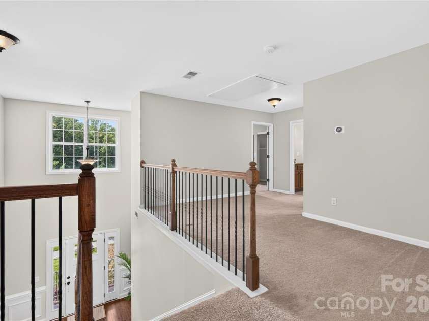 6405 Alba Rose Lane, Huntersville, NC 28078.  MLS# CAR4397325, YatesRealty ID 37262. Large loft/flex area at top of stairs