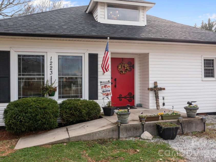 1223 Lafayette Street, Shelby, NC 28152.  MLS# CAR4373858, YatesRealty ID 3727. Small concrete ramp on one side or steps on the other side. Beautiful vintage and extra wide front door.