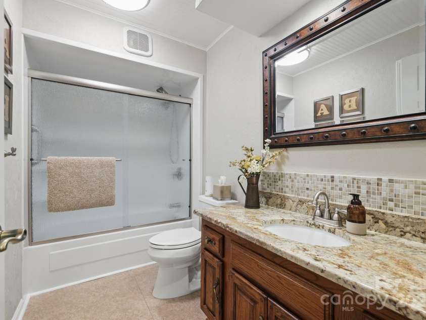 406 Live Oak Lane, Hendersonville, NC 28791.  MLS# CAR4235067, YatesRealty ID 3727. Guest bath