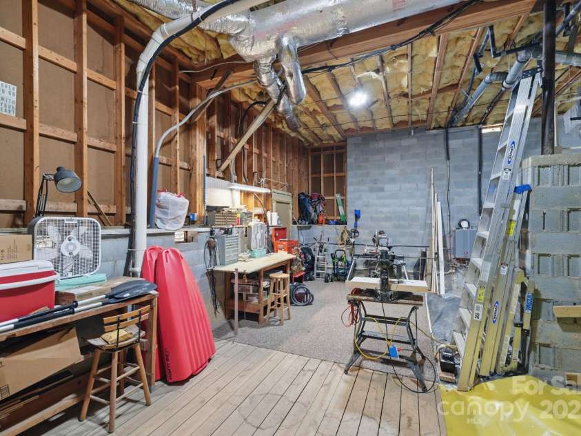 406 Live Oak Lane, Hendersonville, NC 28791.  MLS# CAR4235067, YatesRealty ID 3727. Storage/workshop in crawlspace