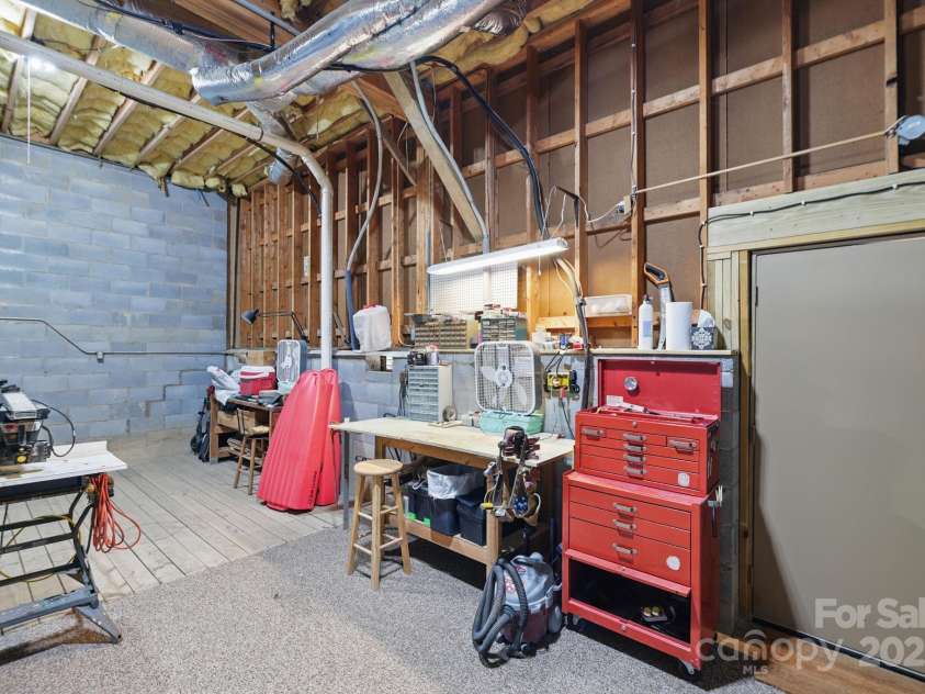 406 Live Oak Lane, Hendersonville, NC 28791.  MLS# CAR4235067, YatesRealty ID 3727. Storage/workshop in crawlspace