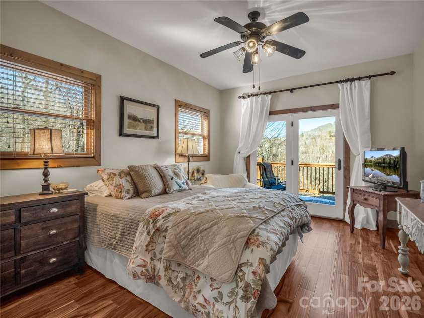 32 Zebulon Lane, Mars Hill, NC 28754.  MLS# CAR4336470, YatesRealty ID 3728. A second bedroom is bright and inviting, with direct access to the back deck as well.