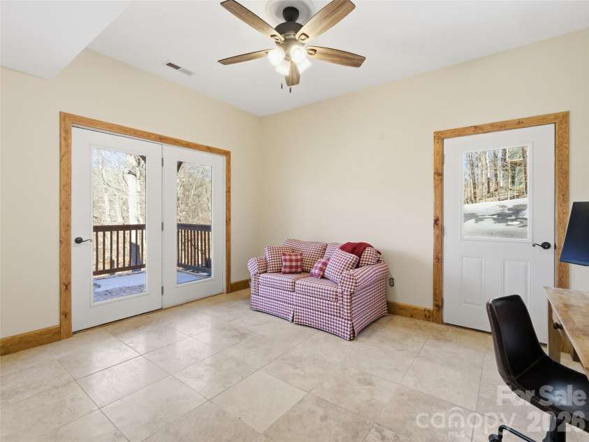 32 Zebulon Lane, Mars Hill, NC 28754.  MLS# CAR4336470, YatesRealty ID 3728. Currently used as an office, this room can be accessed from the driveway or the lower deck and offers a multitude of possibilities!