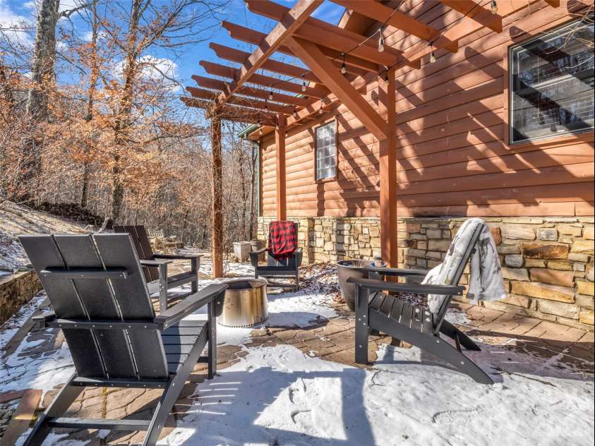 32 Zebulon Lane, Mars Hill, NC 28754.  MLS# CAR4336470, YatesRealty ID 3728. Relaxation is just a few steps from the front door with this firepit setup on the patio.