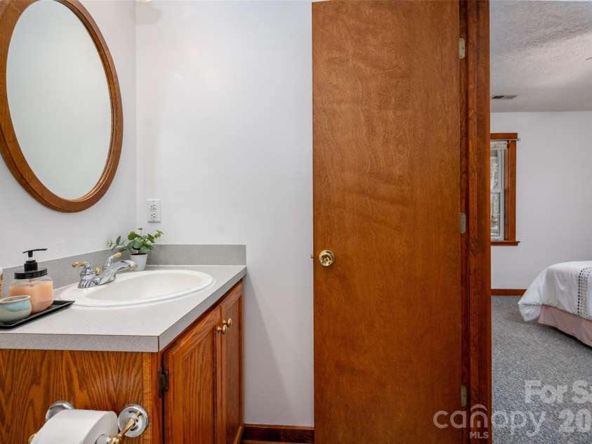 7710 Walkup Road, Waxhaw, NC 28173.  MLS# CAR4344157, YatesRealty ID 3728. 1/2 bath in Primary Bedroom