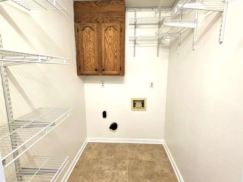 1926 Pinevalley Road, Rock Hill, SC 29732.  MLS# CAR4401771, YatesRealty ID 37296. Utility Room with Ample Shelves and W/D Hookups