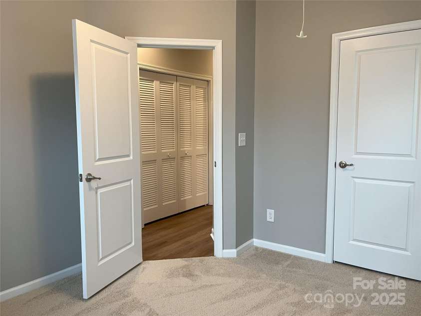 11724 Blessington Road, Huntersville, NC 28978.  MLS# CAR4220282, YatesRealty ID 3732. Upper Level Bedroom 2 with Access to Attic