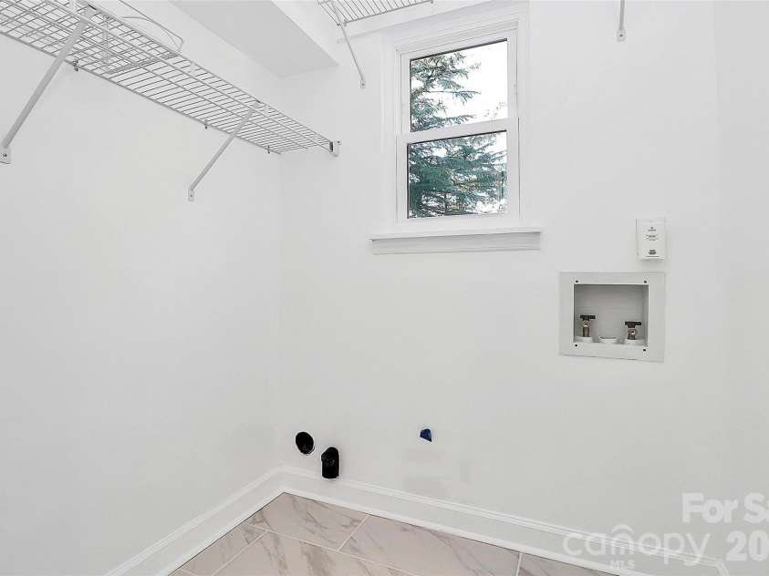 9546 Fairway Ridge Road, Charlotte, NC 28277.  MLS# CAR4403165, YatesRealty ID 37323. Lower level laundry room