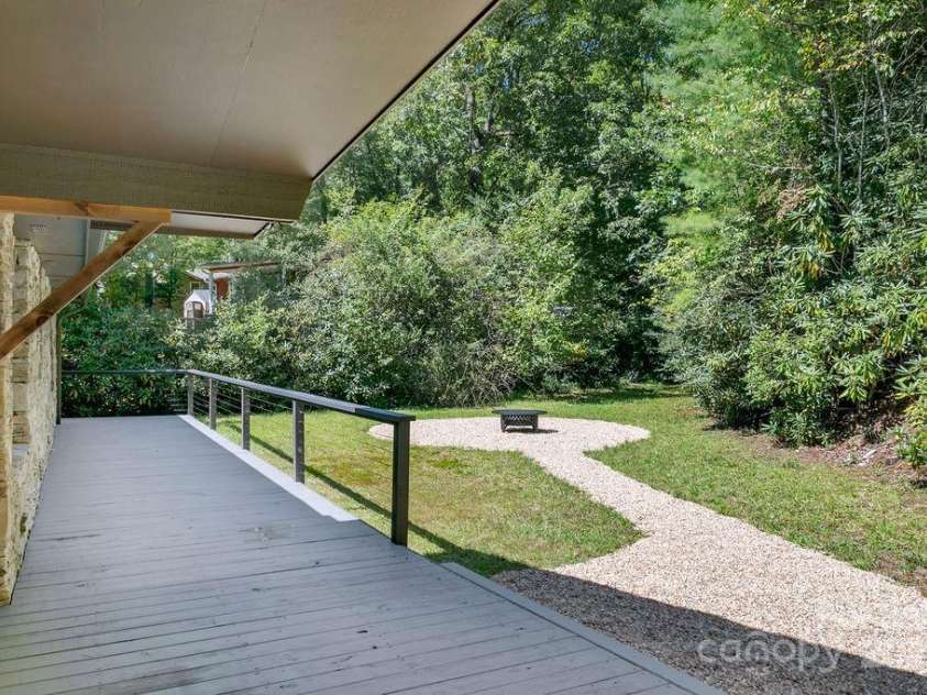 7321 Greenville Highway, Brevard, NC 28712.  MLS# CAR4302860, YatesRealty ID 3738. Back Yard with Firepit beside Creek